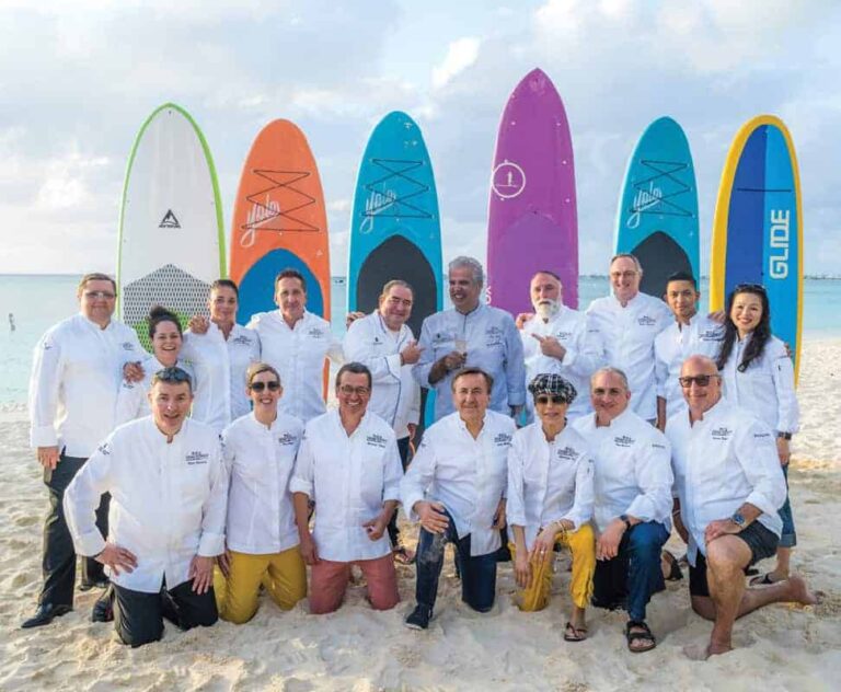 The headlining chefs with a cardboard card of Eric Ripert