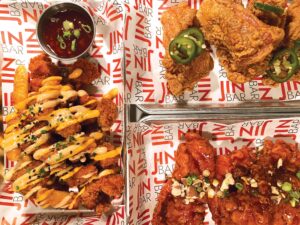 Popcorn chicken; Jin bar fried chicken (JFC) with jalapeño-soy and chili glaze