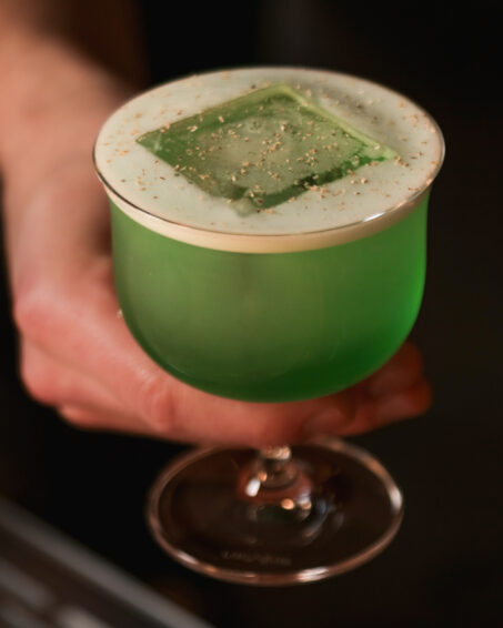 Nitro Swizzle cocktail, made with green Chartreuse, whisky, pineapple and coconut.