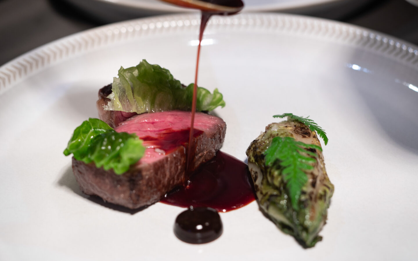 Beef rib, gem lettuce, black garlic, spiced jus.